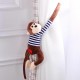 Visiaca plyšová opička v pruhovanom tričku - Oleg